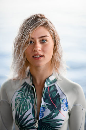 young woman wearing a gray wetsuit