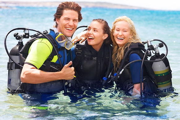 scuba divers wearing wetsuits